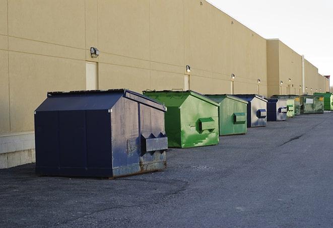 construction dumpsters stacked in a row on a job site in Audubon Park, NJ